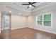 This is a primary bedroom with recessed lighting, wood floors, and a view into the bathroom at 1972 Cambridge Ave, Atlanta, GA 30337
