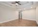 This primary bedroom has a decorative ceiling, recessed lights, and hardwood floors at 1972 Cambridge Ave, Atlanta, GA 30337