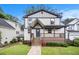 Charming two-story home with a welcoming front porch and well-manicured lawn at 1972 Cambridge Ave, Atlanta, GA 30337