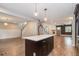 Open concept kitchen with an island and adjacent living room with hardwood floors at 1972 Cambridge Ave, Atlanta, GA 30337