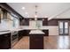 Gourmet kitchen with stainless steel appliances, an island, dark cabinets, and bright counter tops at 1972 Cambridge Ave, Atlanta, GA 30337