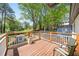 Outdoor deck featuring green backyard views and patio chairs at 308 Reed St, Scottdale, GA 30079