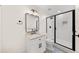 Contemporary bathroom featuring a sleek vanity, modern mirror, and a glass-enclosed shower at 308 Reed St, Scottdale, GA 30079