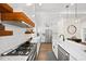 Modern kitchen with stainless steel appliances, quartz countertops, and white subway tile backsplash at 308 Reed St, Scottdale, GA 30079