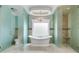 A luxurious bathroom with dual showers and tub beneath a frosted window at 4231 Carrington Ct, Douglasville, GA 30135