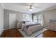 Cozy bedroom featuring hardwood floors, ceiling fan, and a soothing color scheme at 4231 Carrington Ct, Douglasville, GA 30135