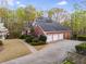 Stately brick home with a spacious 3-car garage and well-manicured landscaping at 4231 Carrington Ct, Douglasville, GA 30135