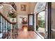 Grand foyer featuring hardwood floors, a staircase, and an open view to the dining room at 4231 Carrington Ct, Douglasville, GA 30135