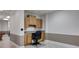 Functional home office area with built-in cabinets, desk, and a rolling chair at 4231 Carrington Ct, Douglasville, GA 30135