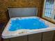 Close-up of a luxurious hot tub with sparkling blue water and jets for relaxation at 4231 Carrington Ct, Douglasville, GA 30135