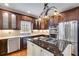 Modern kitchen with granite counters, gas cooktop, stainless appliances, and ample cabinet space at 4231 Carrington Ct, Douglasville, GA 30135