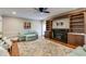 Cozy living room features a fireplace with built-in shelving and large windows at 4231 Carrington Ct, Douglasville, GA 30135