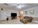 Large living room with a TV, cabinet, and colorful furniture at 4231 Carrington Ct, Douglasville, GA 30135
