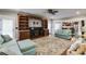 Spacious living room with built-in bookshelves, a fireplace, and access to the kitchen at 4231 Carrington Ct, Douglasville, GA 30135