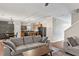 Open-concept living area seamlessly connects to a kitchen and dining space, ideal for modern living at 6407 Barker Station Walk, Sugar Hill, GA 30518