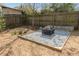 Backyard fire pit area complete with a gravel base and a decorative fire pit at 1611 Flat Shoals Rd, Atlanta, GA 30316