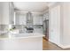 Updated kitchen with modern stainless steel appliances, breakfast bar, and ample cabinet space at 1611 Flat Shoals Rd, Atlanta, GA 30316