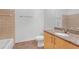Simple bathroom featuring tiled shower/tub combination and vanity with granite countertop at 390 17Th Nw St # 4048, Atlanta, GA 30363