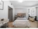 Well-lit bedroom features a comfortable bed, soft decor, and large windows at 390 17Th Nw St # 4048, Atlanta, GA 30363