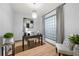 Bright home office with modern decor, hardwood floors, and a large window at 390 17Th Nw St # 4048, Atlanta, GA 30363