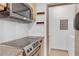 Kitchen area with sleek stainless steel appliances including oven, stovetop, and microwave at 390 17Th Nw St # 4048, Atlanta, GA 30363