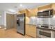 Well-equipped kitchen with stainless appliances and stylish cabinets, perfect for cooking at 390 17Th Nw St # 4048, Atlanta, GA 30363