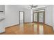 Bright living area with hardwood floors, neutral paint, and a door that leads to a balcony at 390 17Th Nw St # 4048, Atlanta, GA 30363