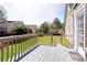 Back deck overlooks the fenced yard of this house, perfect for outdoor entertainment and relaxing at 430 Holly Stream Trl, Roswell, GA 30075