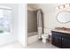 Bathroom featuring grey subway tile in the shower, granite counters, and bright natural light at 430 Holly Stream Trl, Roswell, GA 30075