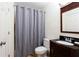 Bathroom featuring a vanity, toilet and a shower with a curtain at 430 Holly Stream Trl, Roswell, GA 30075