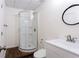 Bathroom features white single vanity, shower with glass door, and modern fixtures at 430 Holly Stream Trl, Roswell, GA 30075