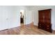 Bedroom featuring wood floors, closet, and access to an ensuite bathroom at 430 Holly Stream Trl, Roswell, GA 30075