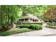 Exterior view of the neighborhood clubhouse, featuring a covered porch and surrounded by well-maintained landscaping at 430 Holly Stream Trl, Roswell, GA 30075