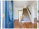 Inviting foyer with hardwood floors and decorative glass front door at 430 Holly Stream Trl, Roswell, GA 30075