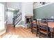 This is a light filled living room with stone fireplace and staircase at 430 Holly Stream Trl, Roswell, GA 30075