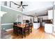 Open floorplan view of the kitchen and dining rooms, both with wood floors at 430 Holly Stream Trl, Roswell, GA 30075