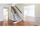 Spacious foyer with hardwood floors and a carpeted staircase at 430 Holly Stream Trl, Roswell, GA 30075
