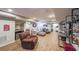 Finished basement living area with sports decor, laminate flooring, comfy seating, and kitchenette at 4537 Ashmore Cir, Marietta, GA 30066
