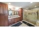 Bathroom with double vanity, granite countertop, and tiled walk-in shower with glass enclosure at 4537 Ashmore Cir, Marietta, GA 30066