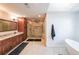 Bright bathroom featuring a walk-in shower, soaking tub, and granite double vanities at 4537 Ashmore Cir, Marietta, GA 30066