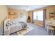 Cozy bedroom with a neutral palette, plush rug, and ample natural light at 4537 Ashmore Cir, Marietta, GA 30066