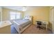 This ample bedroom is well-lit with an ample window, closet, and room for a desk at 4537 Ashmore Cir, Marietta, GA 30066