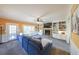 Cozy living room with a stone fireplace, built-in shelving, and a comfortable blue sofa at 4537 Ashmore Cir, Marietta, GA 30066