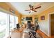Well-lit home office with large windows, ceiling fan, and plenty of space for working from home at 4537 Ashmore Cir, Marietta, GA 30066