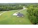 Aerial shot of the property with lush green lawn and surrounding trees at 340 Taylor Path, Dallas, GA 30157