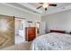 Bedroom features modern sliding barn door to bathroom and walk-in, in addition to ensuite bath at 340 Taylor Path, Dallas, GA 30157