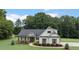 Charming one-story home featuring vertical siding and well-manicured landscaping at 340 Taylor Path, Dallas, GA 30157