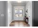 Elegant foyer with wood floors, modern lighting, and view to the outside at 340 Taylor Path, Dallas, GA 30157