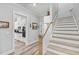 Bright, welcoming foyer with stairs and doorway into kitchen at 340 Taylor Path, Dallas, GA 30157