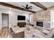 Comfortable living room featuring exposed wood beams, brick fireplace, and plush seating at 340 Taylor Path, Dallas, GA 30157